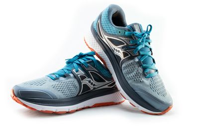 Blue, Orange, and Grey Running Shoe on White Background Shot in a Studio
